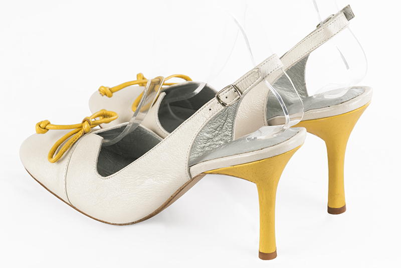Off white women's open back shoes, with a knot. Round toe. Very high slim heel. Rear view - Florence KOOIJMAN